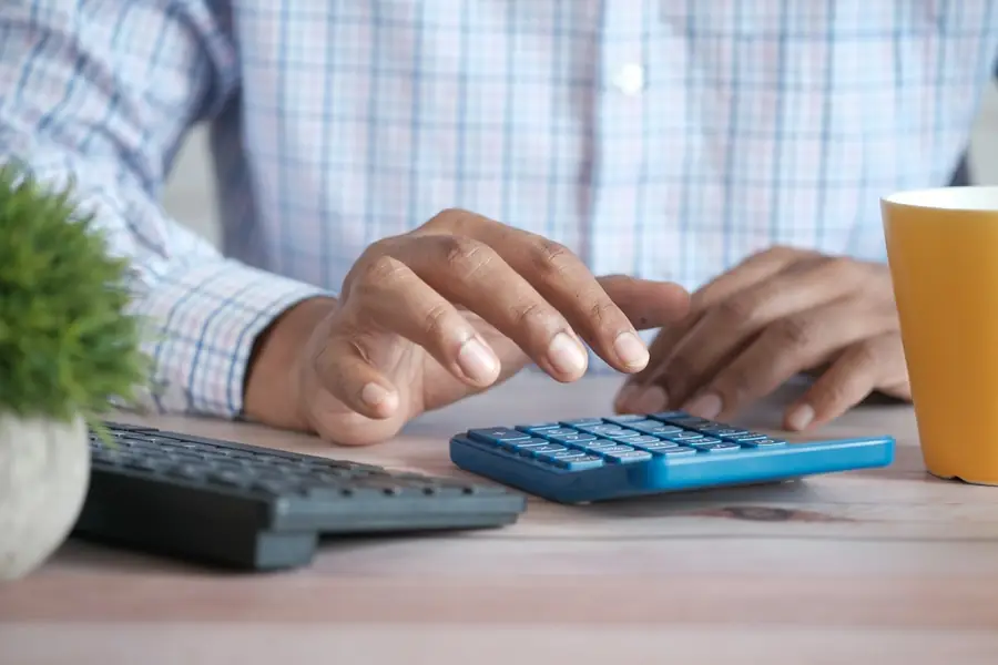 Calculator and paperwork on a desk