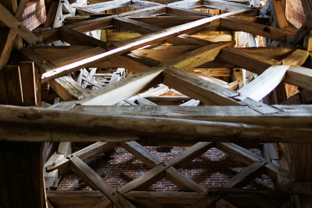 Exposed historic roof timbers and lath in a period property